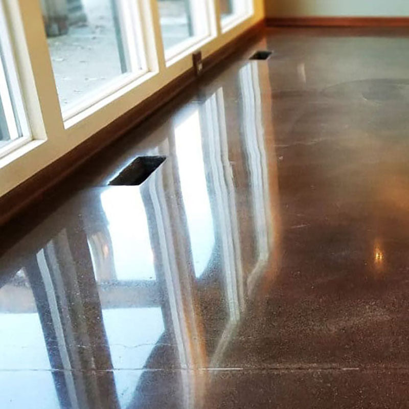 A concrete floor that has been polished by Standard Paint & Flooring.