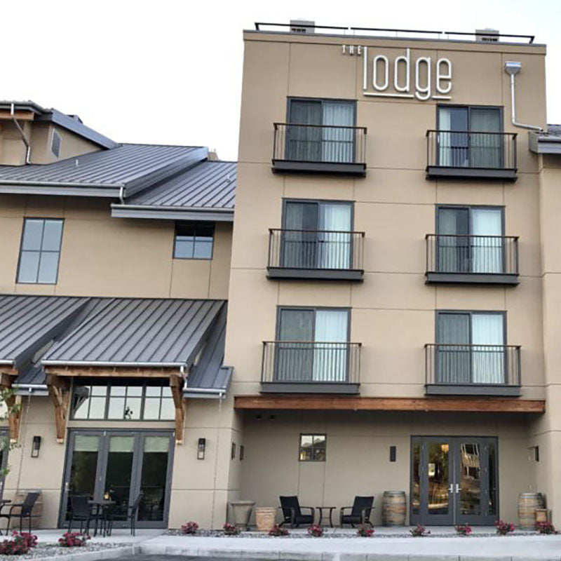 Exterior of the Lodge with new stucco by Standard Paint & Flooring.