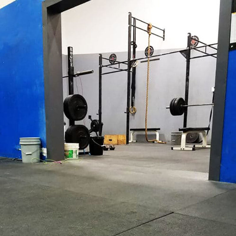 A gym under renovation with flooring by Standard Paint & Flooring.