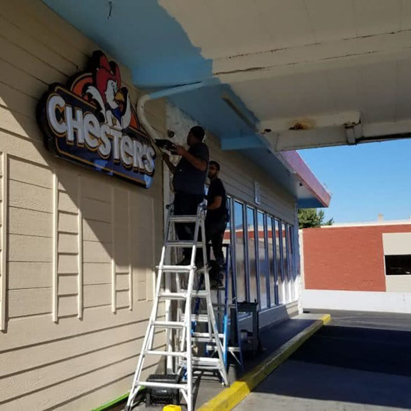 Exterior of Chester's restaurant that has been painted with beige exterior paint from Standard Paint & Flooring.