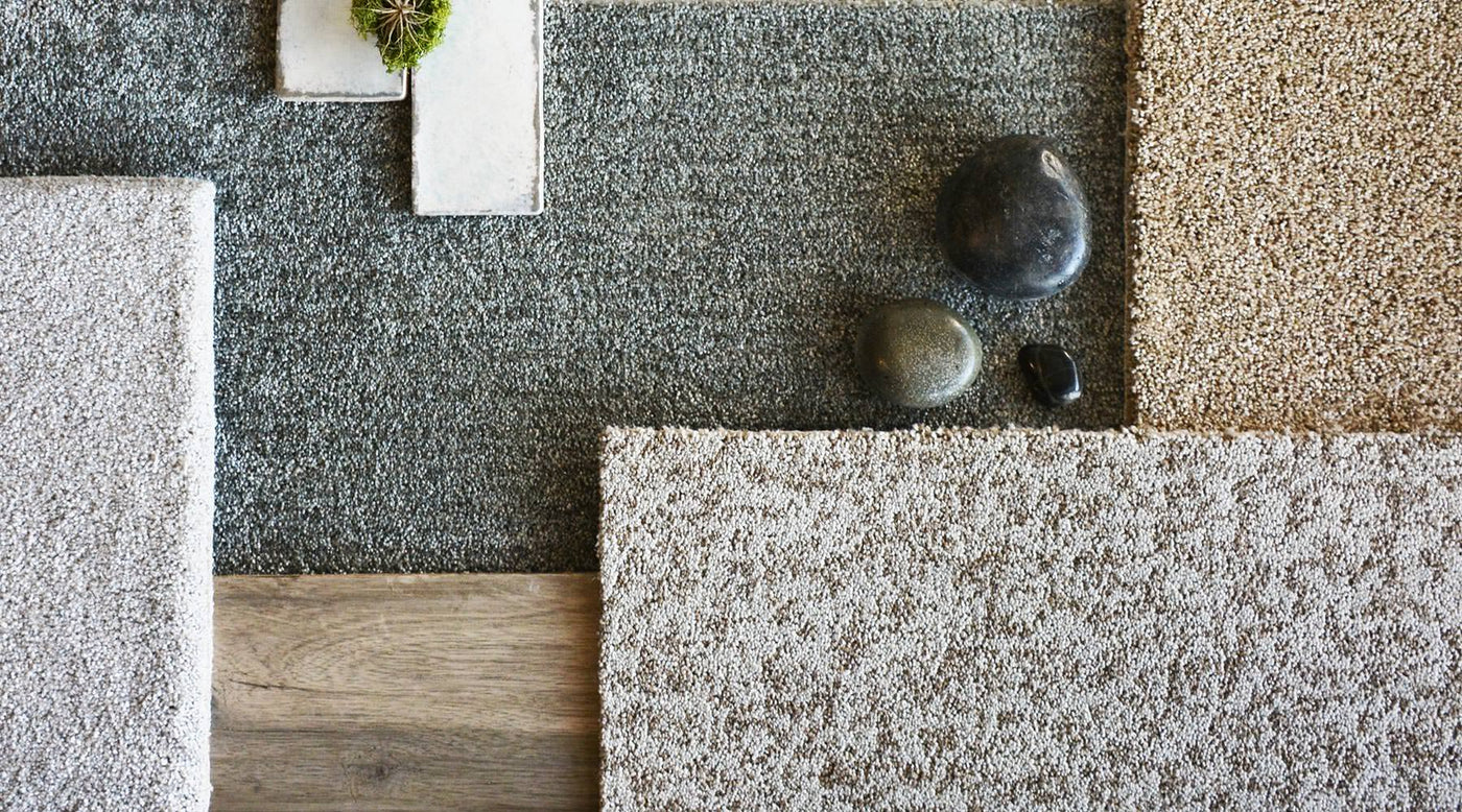 Shaw Bellera carpet swatches in light grey, dark grey, white and brown tones.
