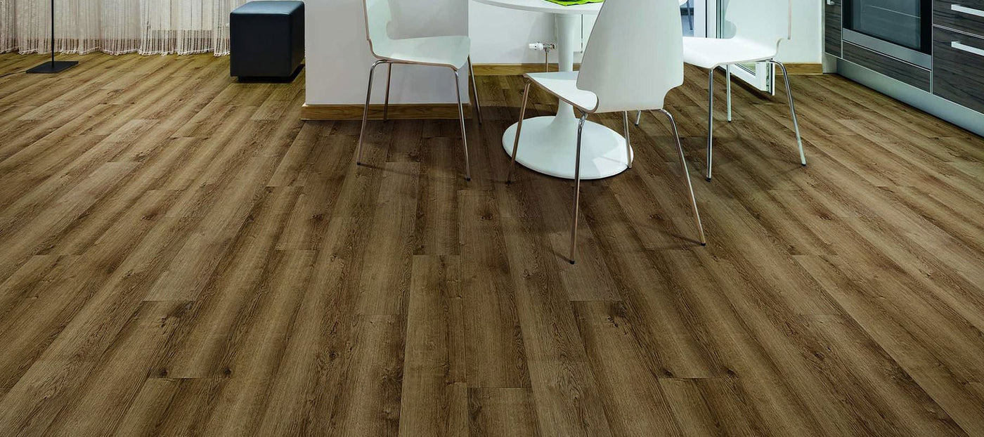 Kitchen flooring with COREtec luxury vinyl flooring in Monterey Oak, available at Standard Paint & Flooring in Washington State and Oregon.