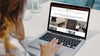 A woman browsing the Standard Paint & Flooring website on a macbook laptop.